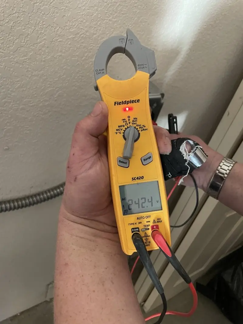 Voltage testing with clamp meter during Generator Installation in South Sarasota